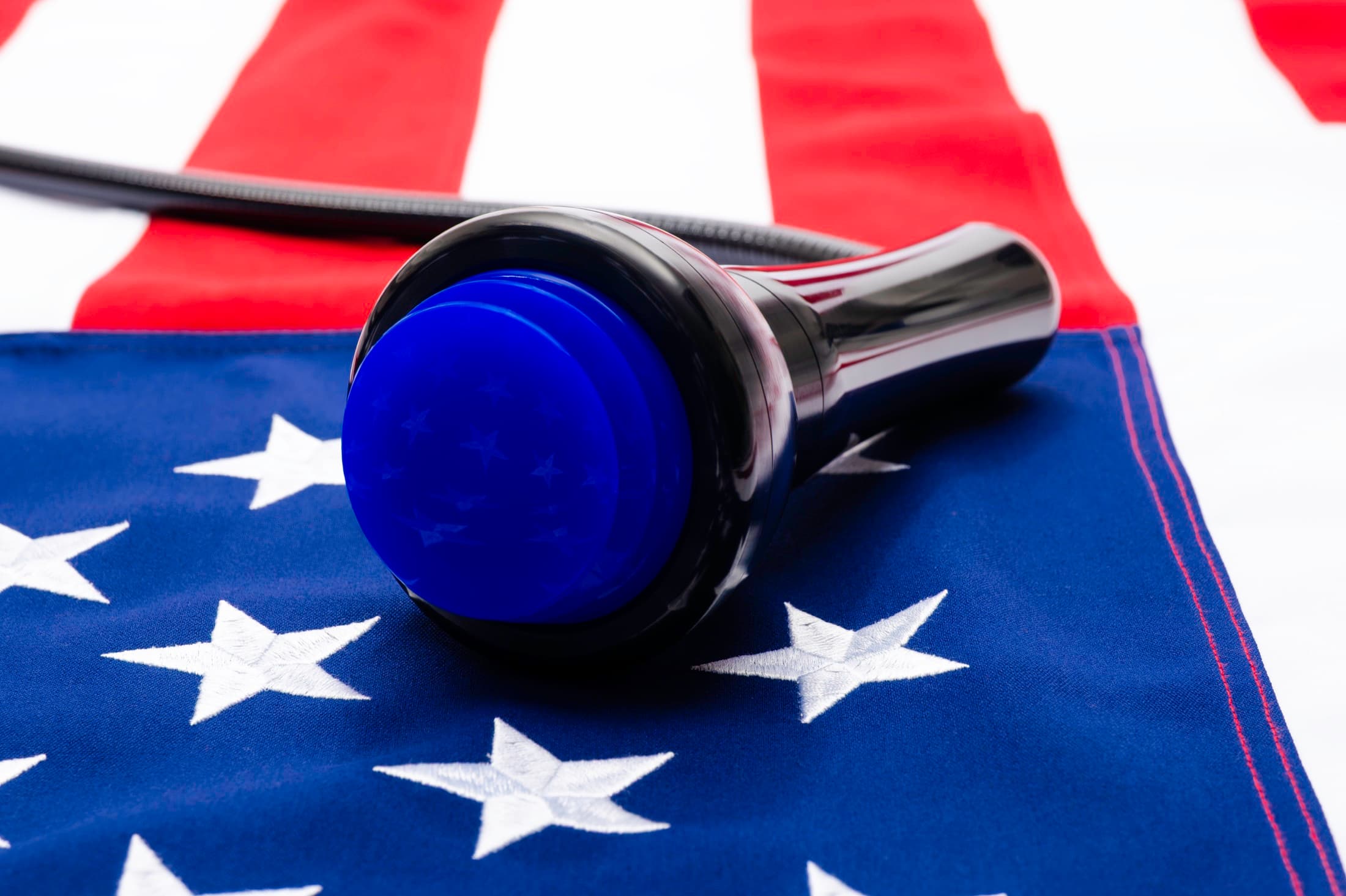 QuasoniQ+™ handpiece photographed against the American flag